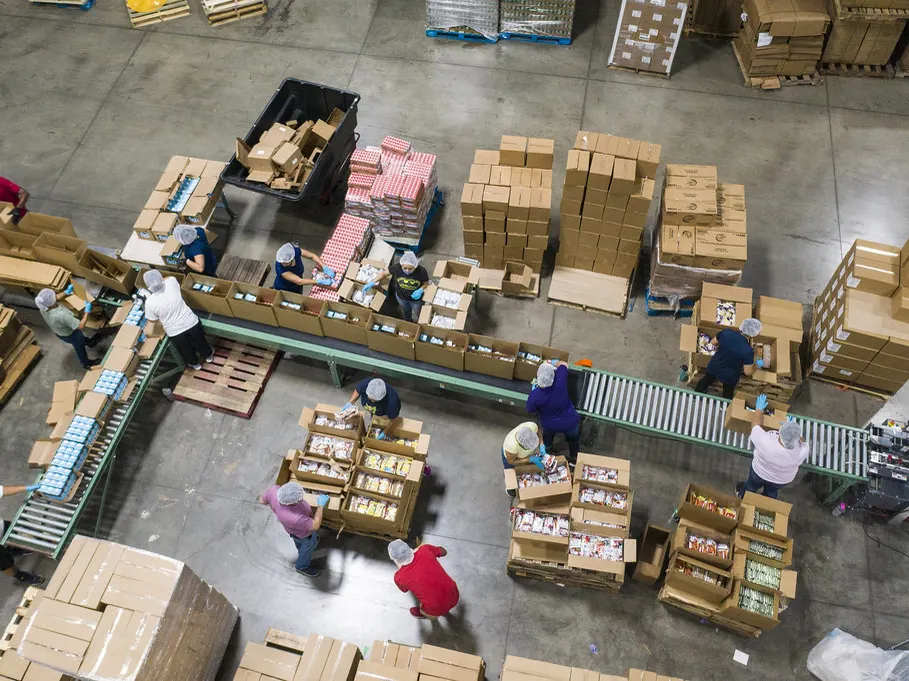 Overhead view of a fulfillment floor with boxes on conveyors